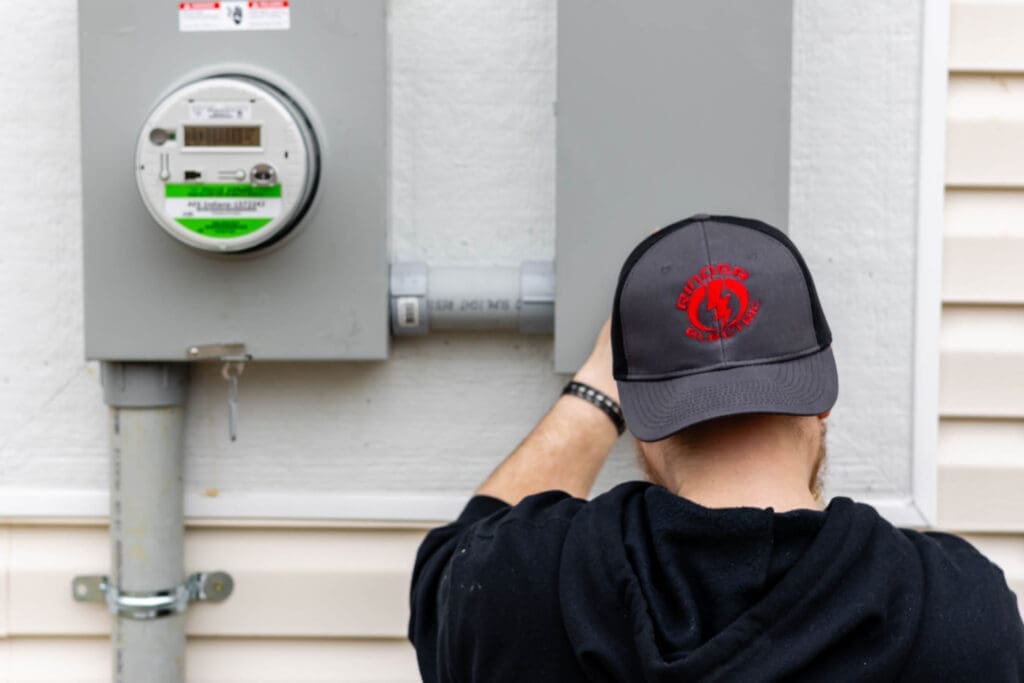 Electrician installing electric meter.